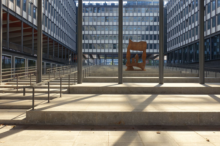 A photo of concrete steps and metal pillars outside a windowed building on Jussieu campus in Paris, France