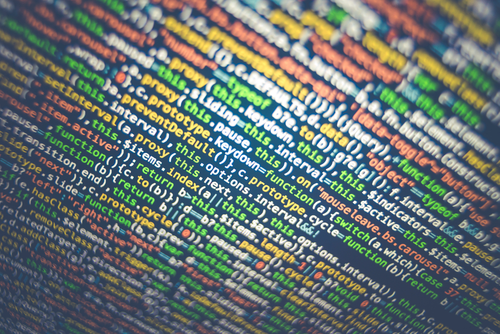 A close-up photo of multicoloured computer code on a black screen. Credit: Photo by Markus Spiske on Unsplash