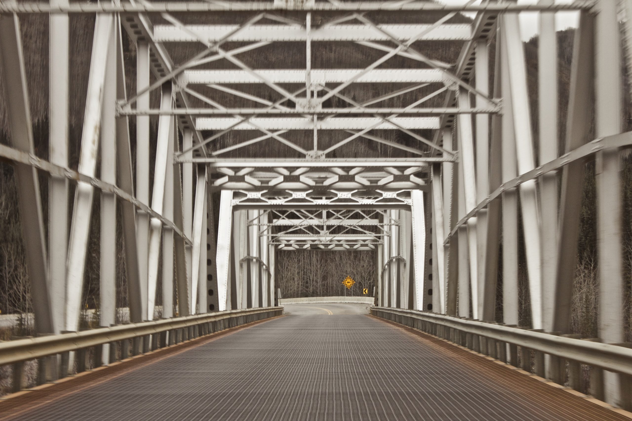 A photo of an empty grey metal bridge